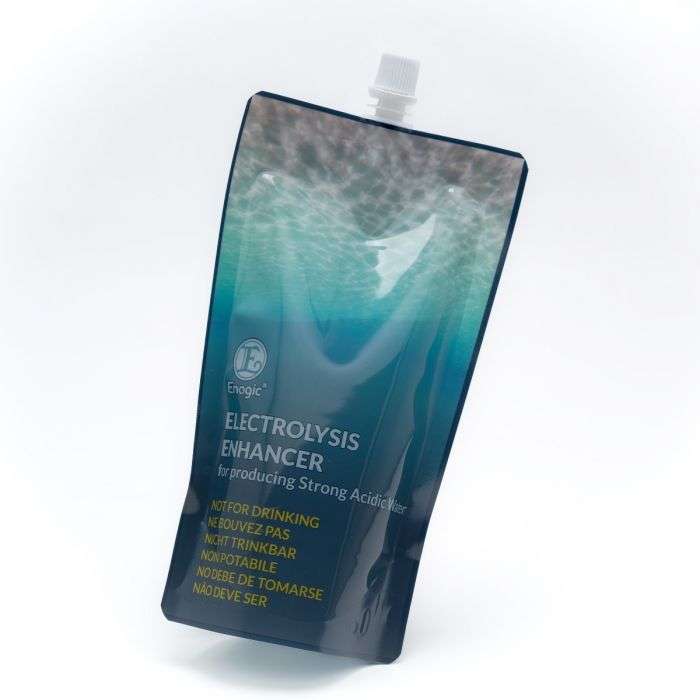 A standing pouch labeled Electrolysis Enhancer with warnings in multiple languages stating Not for Drinking. The pouch has a blue and green gradient design and a white twist cap on top.